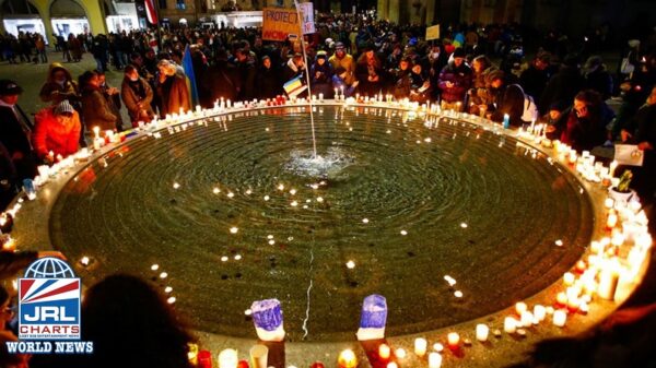 People Place Candles on a Fountain during anti-war protest of Russia's invasion of Ukraine-REUTERS-Arnd Wiegmann-jrl-charts-lgbt-world-news